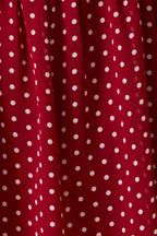 Close-up of red fabric with white polka dots